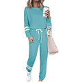 Plus size women's loose-fitting casual suit set in a solid colour, comprising a long-sleeved top and pants.