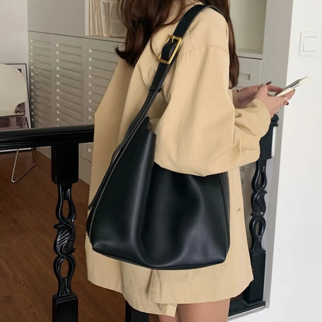 Soft black and brown PU leather ladies shoulder bags with swing thread decorative detail.