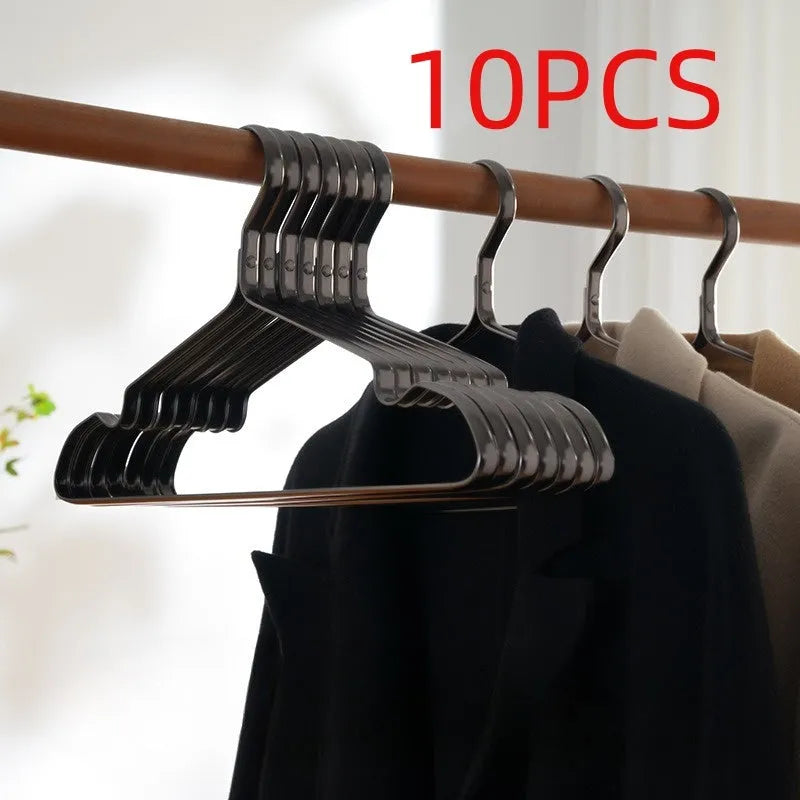 A single elegant black non-slip clothes hanger on a white background.