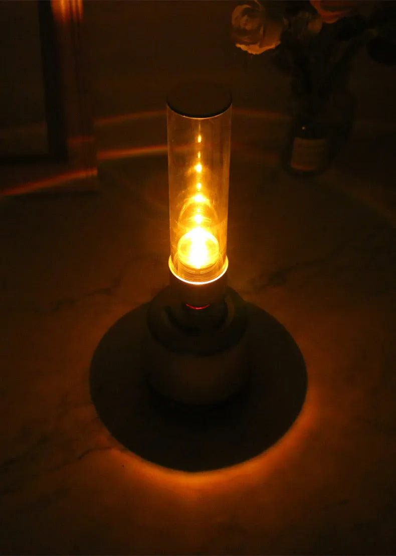 White silver Bluetooth speaker with candlelight night light feature measuring 90x277mm