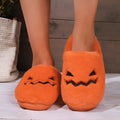 Orange Halloween pumpkin slippers with plush lining and non-slip PVC soles
