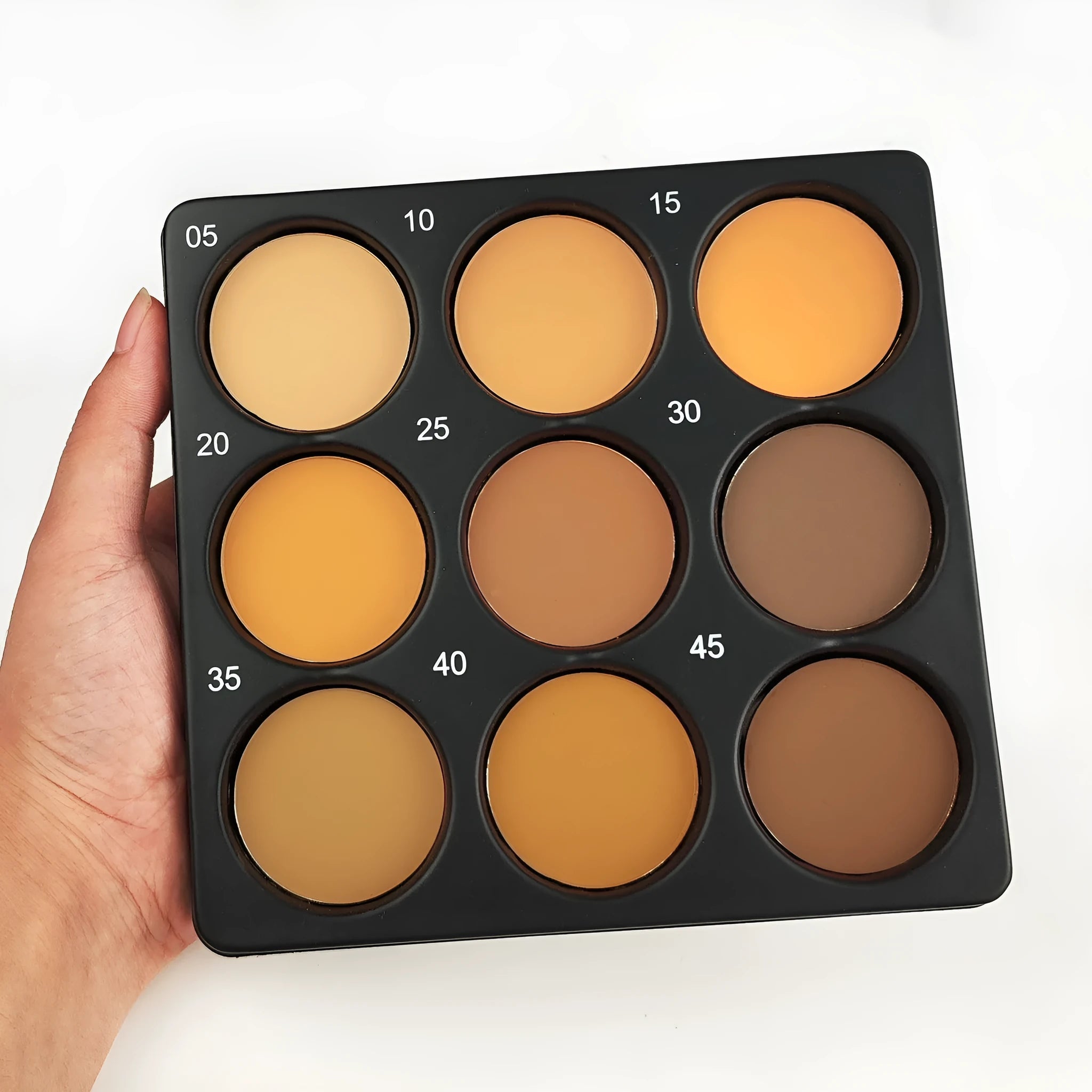 Dark matte makeup palette with nine colours and a repair disk.