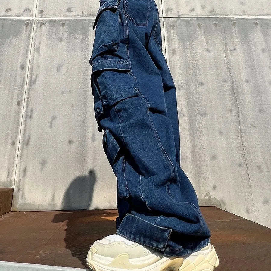 Dark blue distressed wide-leg high waist women's jeans with multiple pockets.
