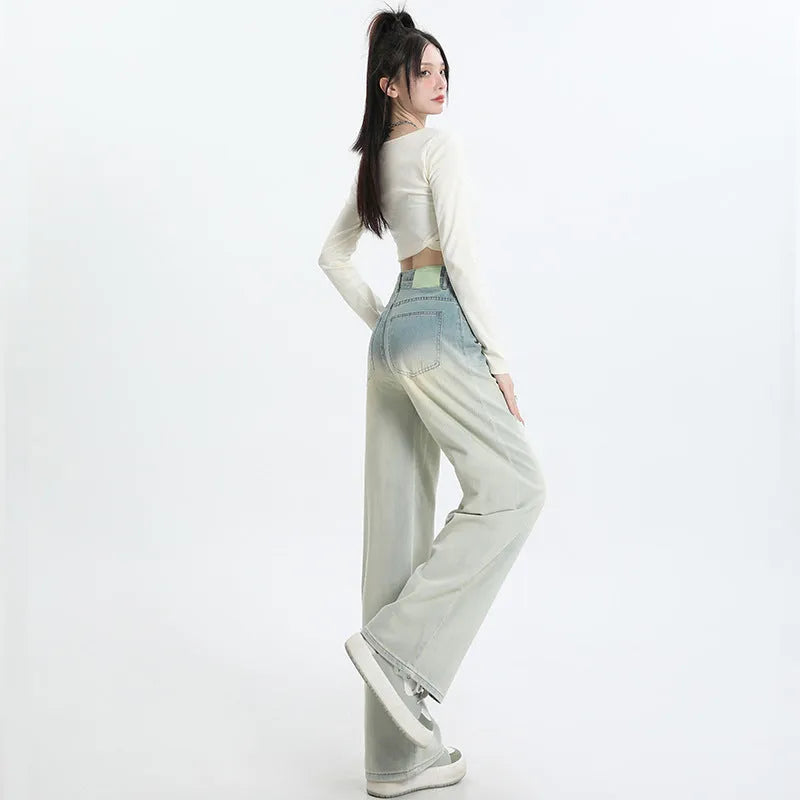 Women's gradient blue straight-leg denim trousers showing wide-leg design