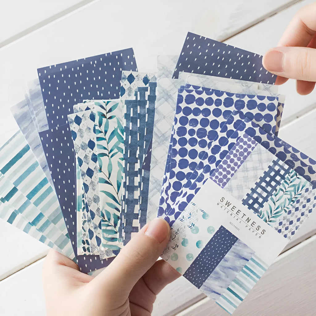 Pack of 50 retro collage design note papers in dessert-themed colours, each sheet 56mm by 83mm.