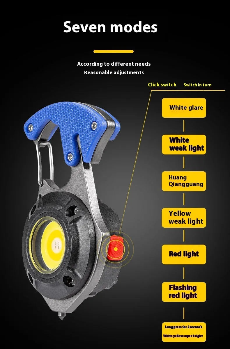 Compact silver and black multifunction keychain torch with window breaker tip and seven LED light modes.