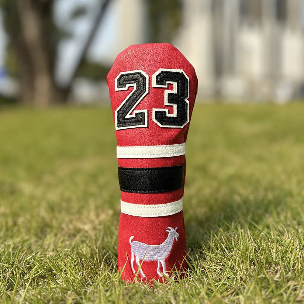 Red square putter iron head golf club sleeve covering a wooden pole set