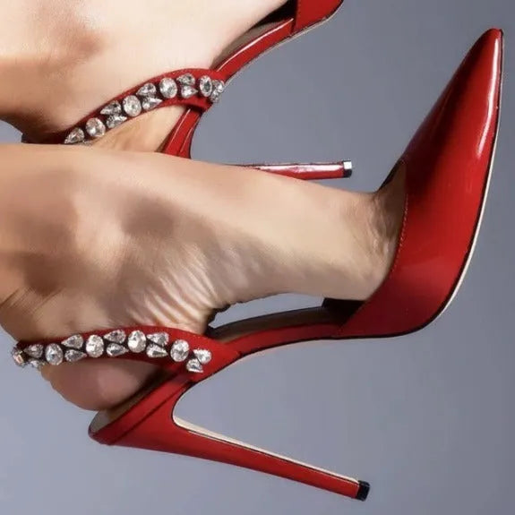 Black patent leather women's high heel sandals with pointed toes and side rhinestone straps.
