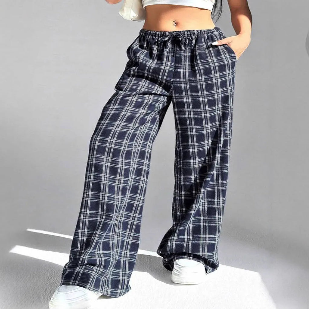 Women's loose fit plaid trousers with drawstring waistband and side pockets in blue colour