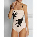 Women's one-piece bikini swimsuit with a gauze skirt in sizes S to XL.