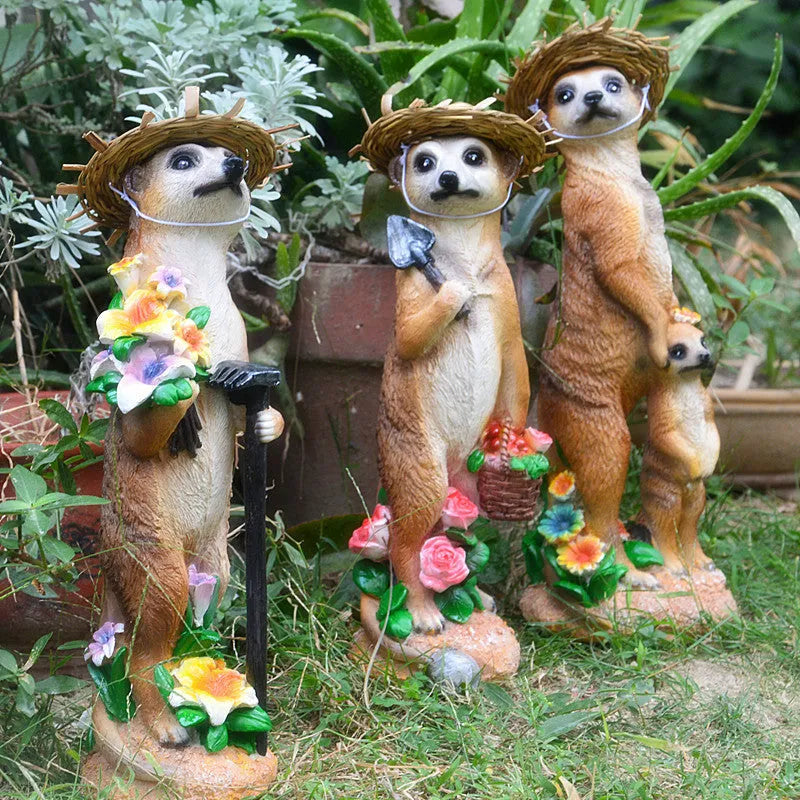 Yellow-brown resin mongoose garden ornaments with straw hats and gardening tools