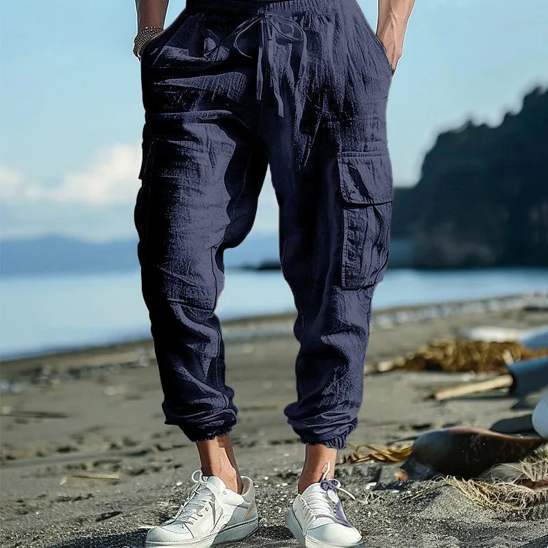 Men's casual linen trousers with ankle-tied cuffs and multi-pocket design in solid colour