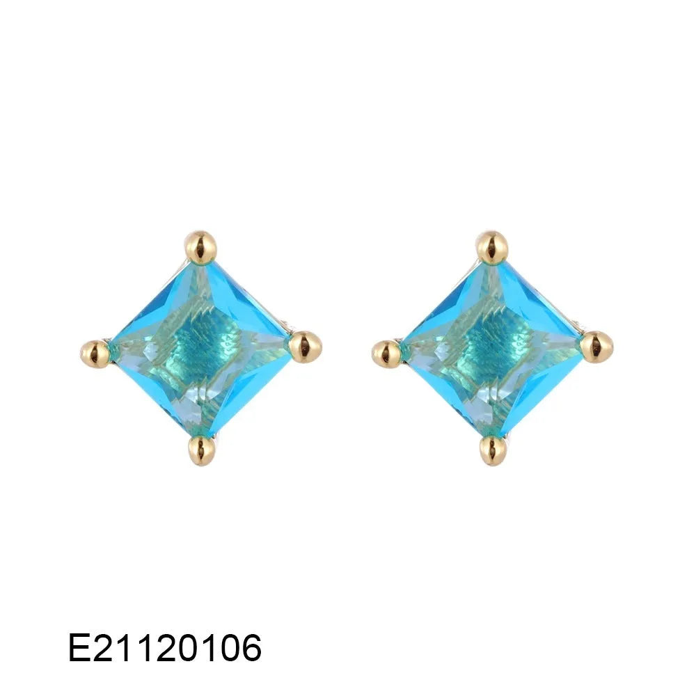 Gold-plated drop-shaped earrings with zircon accents in candy colours on white background