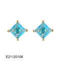 Gold-plated drop-shaped earrings with zircon accents in candy colours on white background