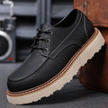 Men's black retro low-top Martin boots with a round toe and non-slip rubber sole.
