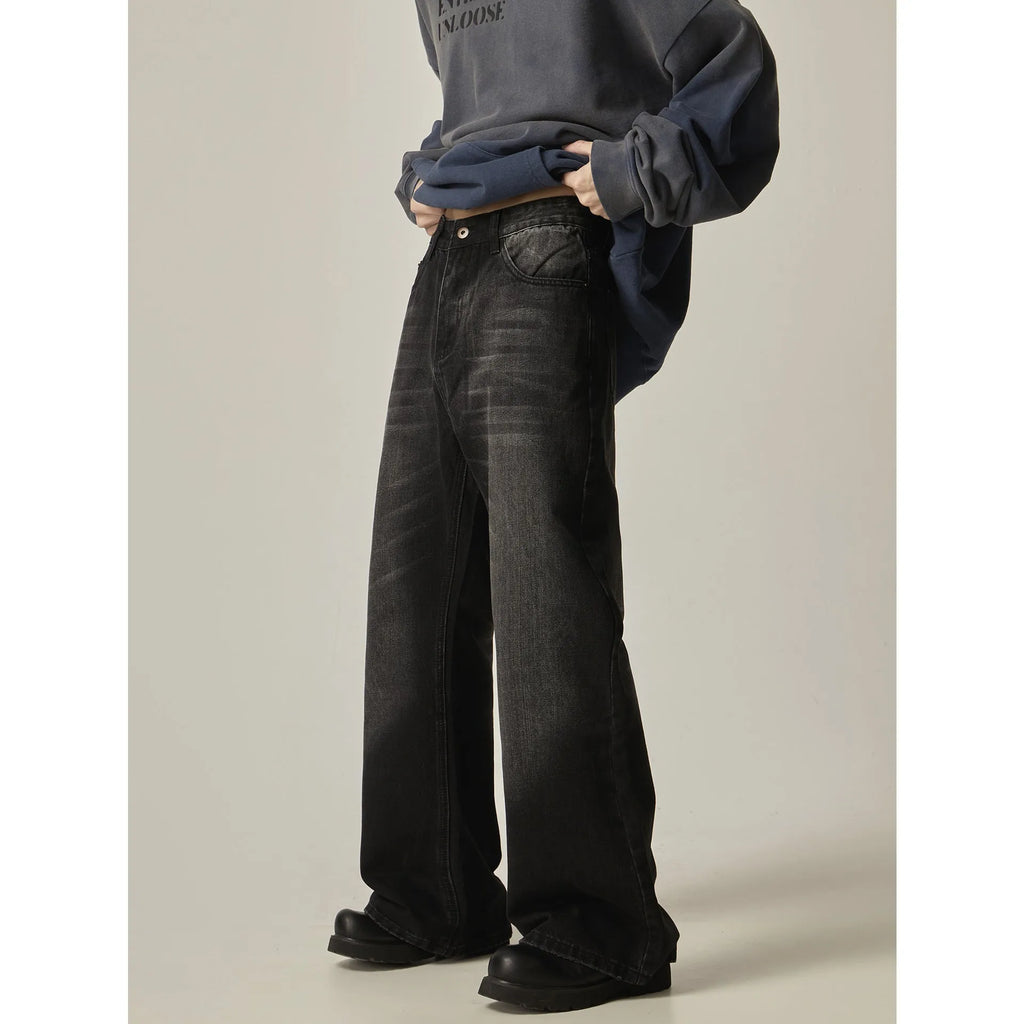 Black loose straight-leg jeans with retro styling and zipper fly