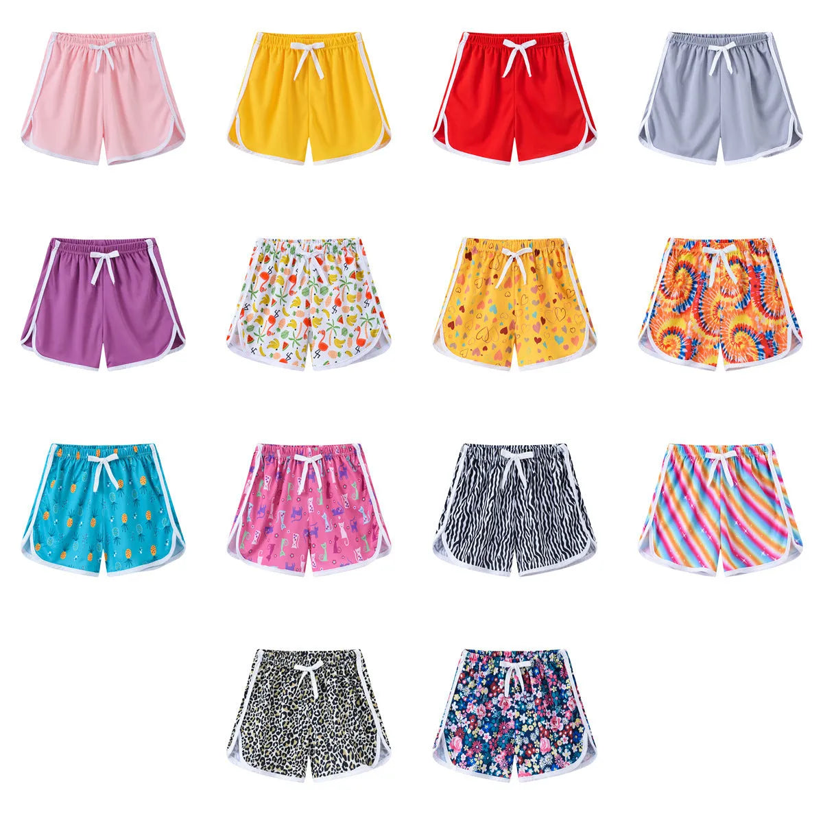 Children's polyester beach shorts in various colors and patterns including pineapple and kitten designs for sizes 100 to 140