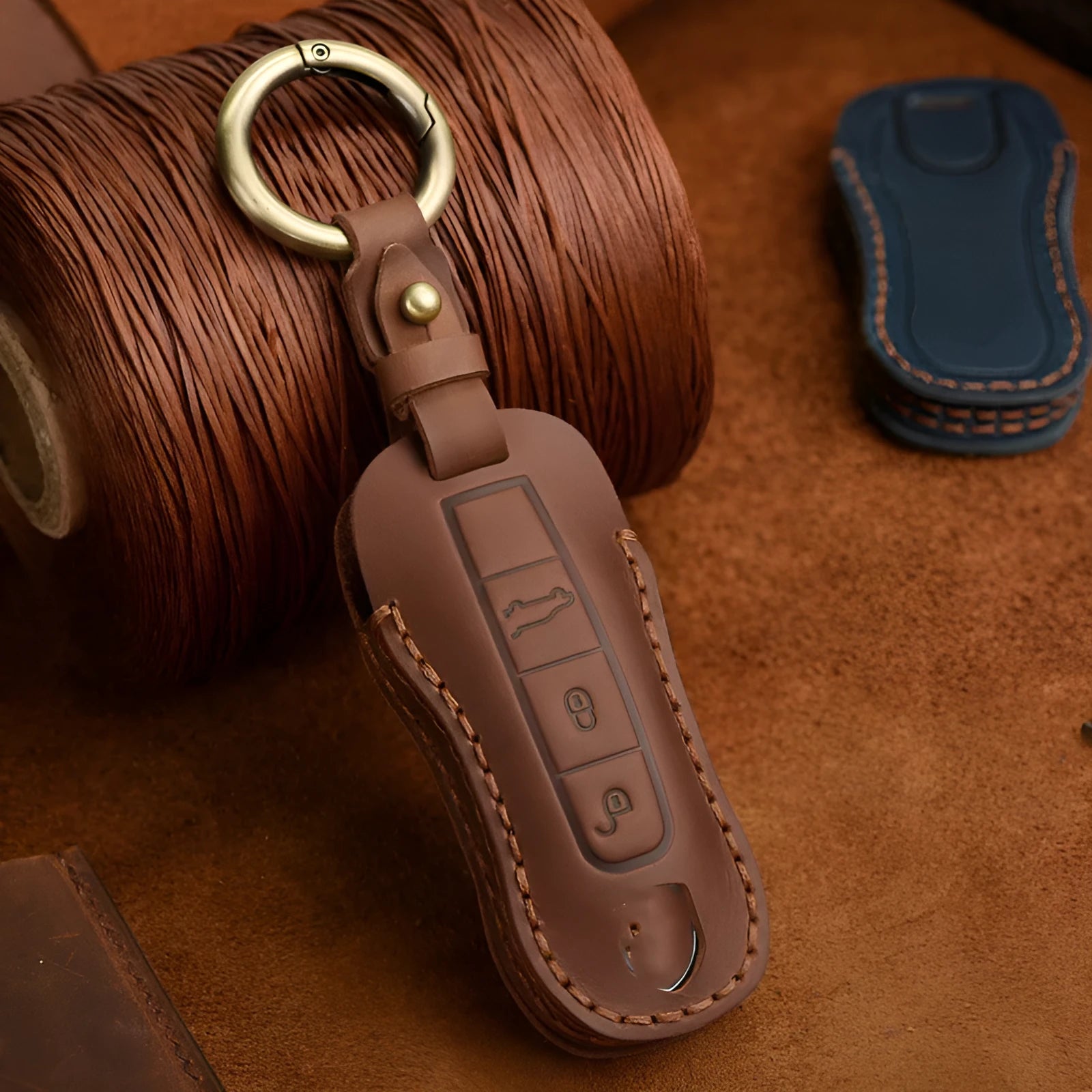 Authentic cowhide leather Porsche key cover with retro buckle closure in blue colour
