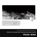 Oversized natural rubber mouse pad with wrist rest in gaming design on desk