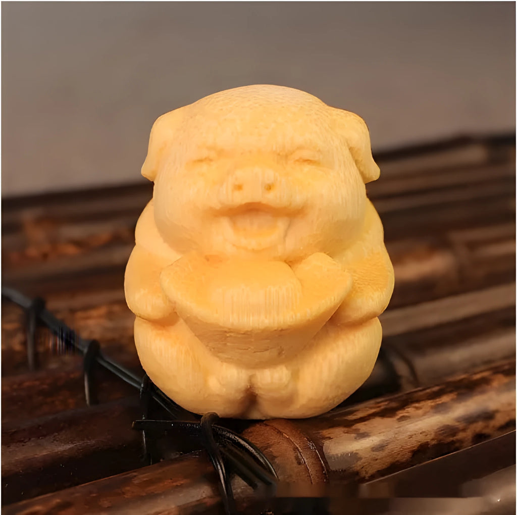 Solid bamboo carving pig ornament measuring 4cm height by 3.5cm diameter