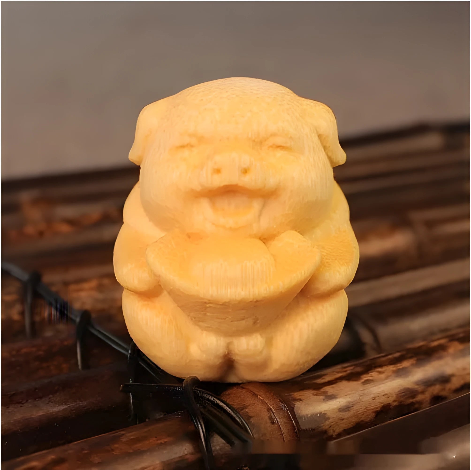 Solid bamboo carving pig ornament measuring 4cm height by 3.5cm diameter