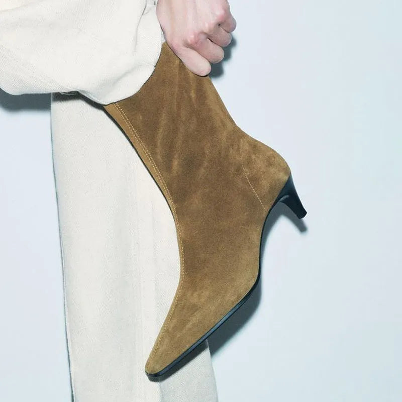 Brown women's square toe ankle boots with a side zip and a mid-height stiletto heel.