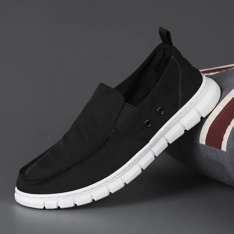 Men's colour matching leather shoes with round toe and elastic band closure in black and white colour option