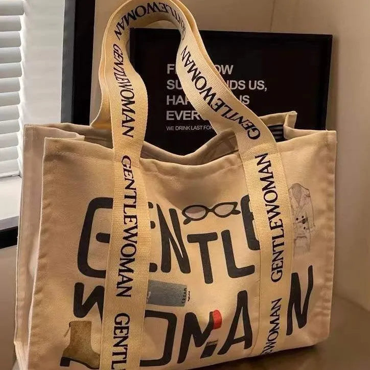 Large capacity canvas tote bag showing three design options: black letters, coloured letters, and pattern print