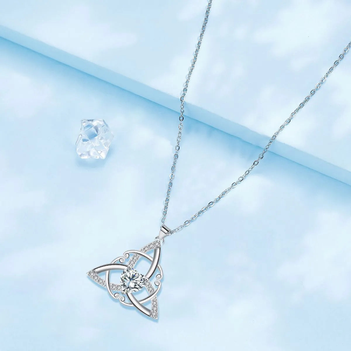 Women's geometric Celtic knot pendant necklace in copper with electroplated blue finish