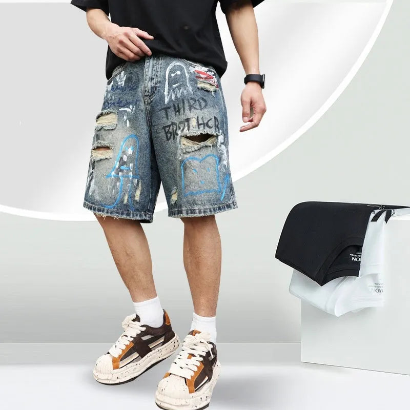 Blue ripped men's denim shorts with graffiti design and zipper fly