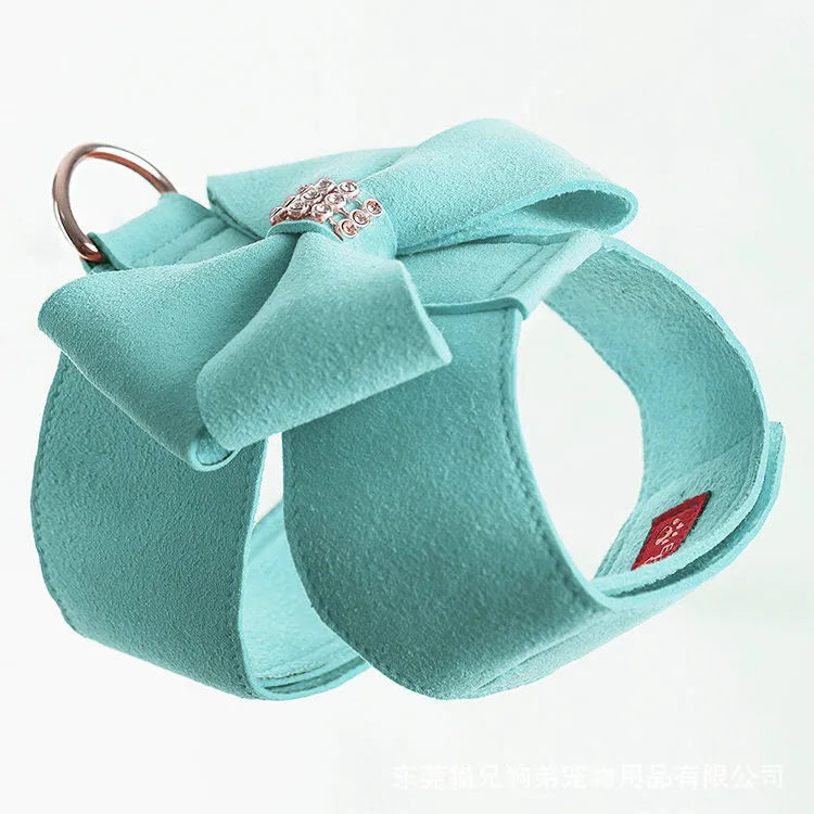 Adjustable puppy chest strap with bowknot design in microfiber material showing pink blue orange colour options