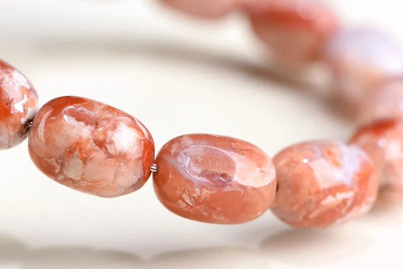 Natural cherry agate barrel bead bracelet with 10x14mm geometry beads and ruyi charm