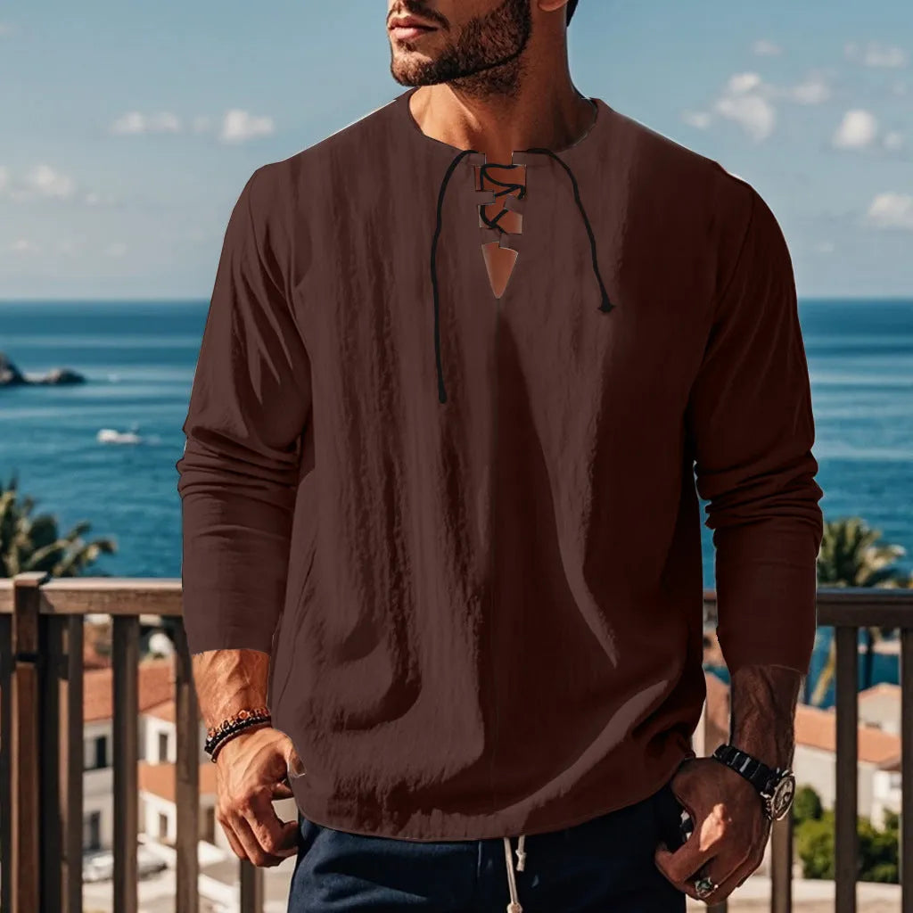 Cotton linen beach ruff shirt in a loose pullover style on a hanger.