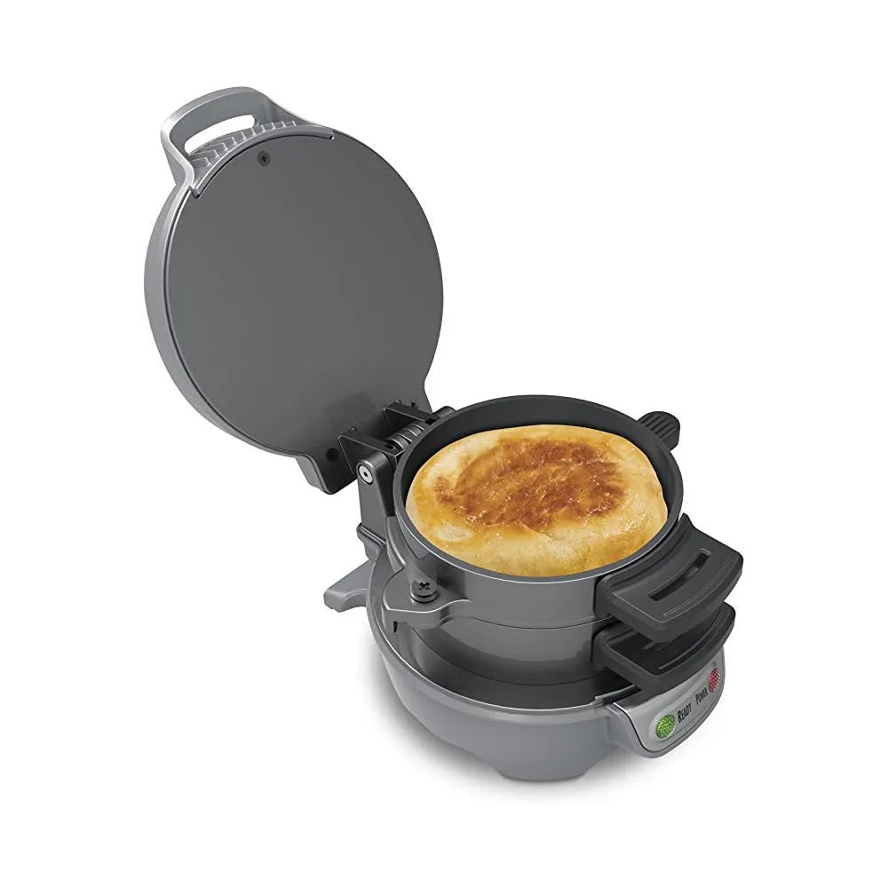 Bright red breakfast sandwich maker with egg cooker ring and baking trays on kitchen counter