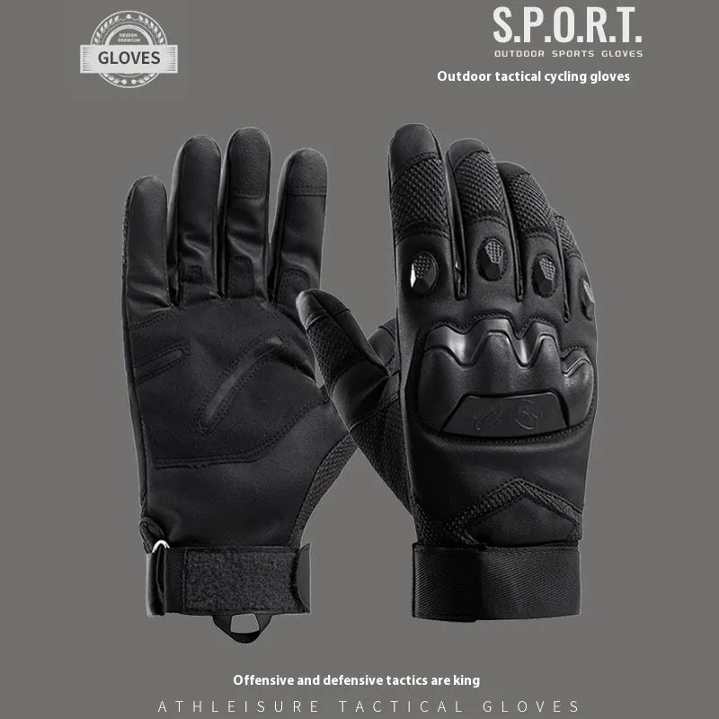 Men's black tactical gloves with touch screen fingertips on a hand holding a smartphone