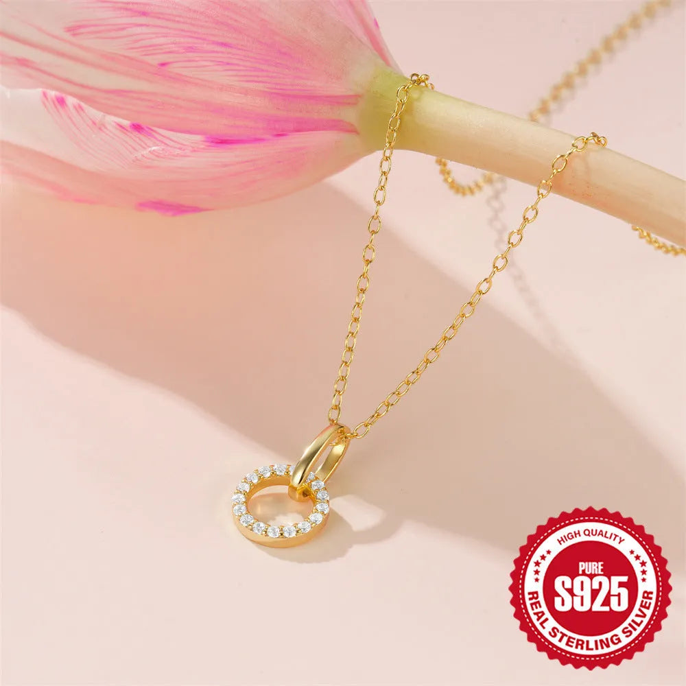 Gold colour S925 sterling silver clavicle chain necklace with a round zircon pendant on an adjustable chain.