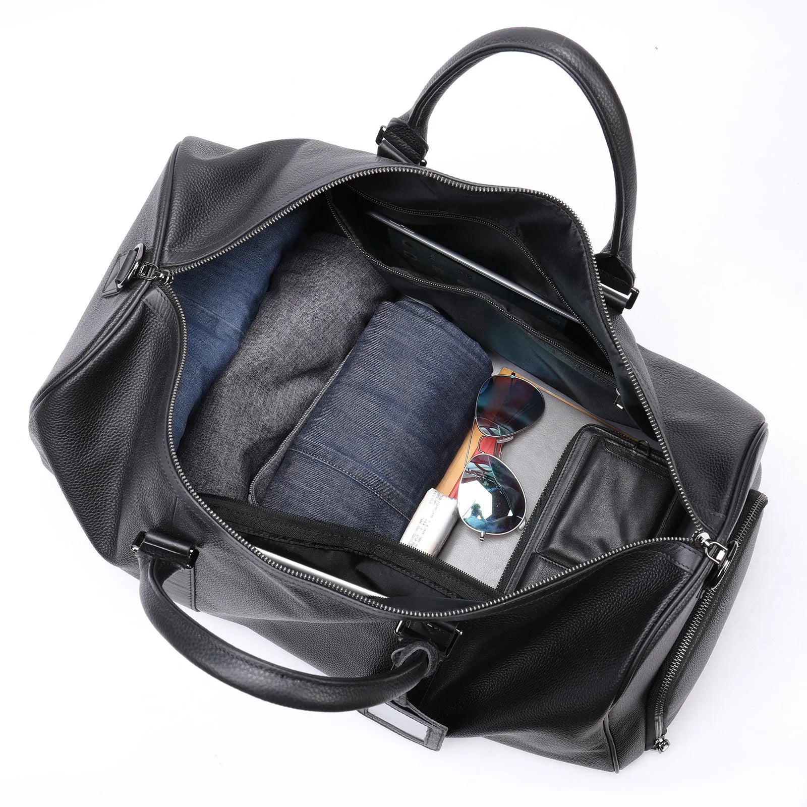 Men's black leather excursion tote bag with a single shoulder strap shown next to a coffee brown version.