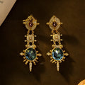 Geometric court style retro stud earrings with gold finish and round elements