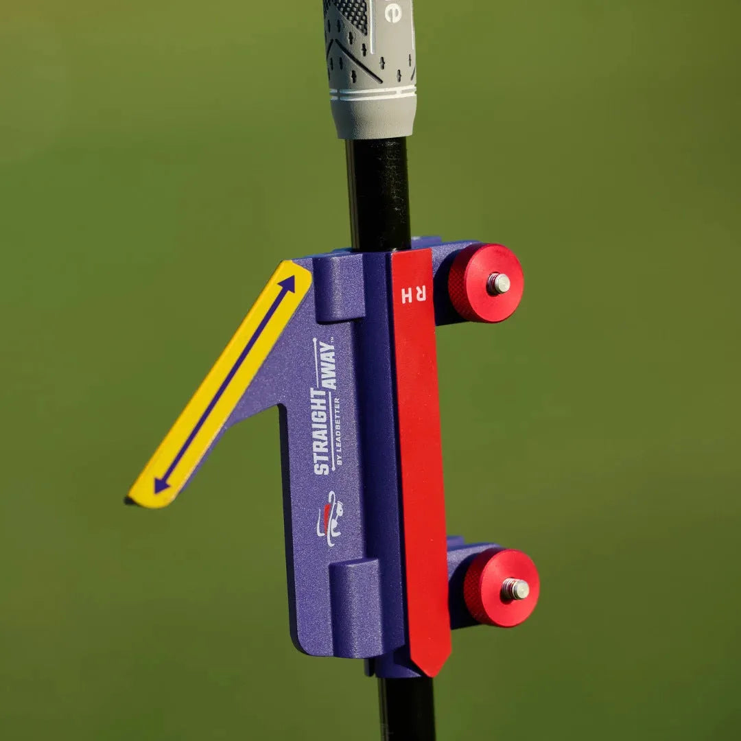 Plastic golf swing plane simulator trainer on practice surface