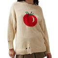 Women's milky white acrylic round neck sweater with jacquard long sleeves, laid flat.