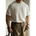 Women's loose-fitting casual pullover top with raglan sleeves in a terry texture fabric.