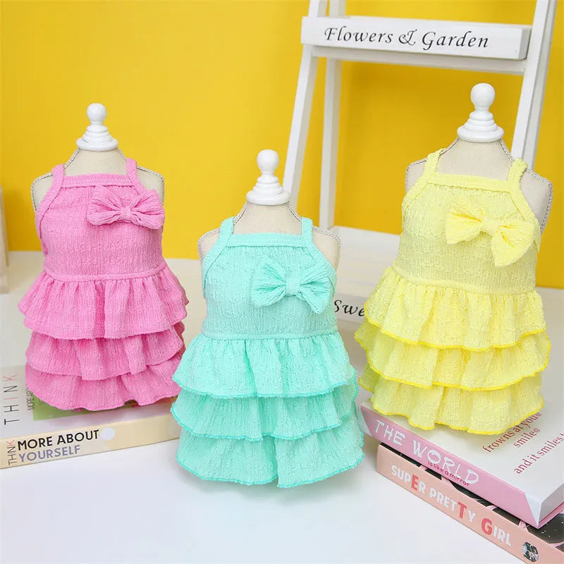 Small dog wearing polyester princess dress with layered candy skirt in rose red colour