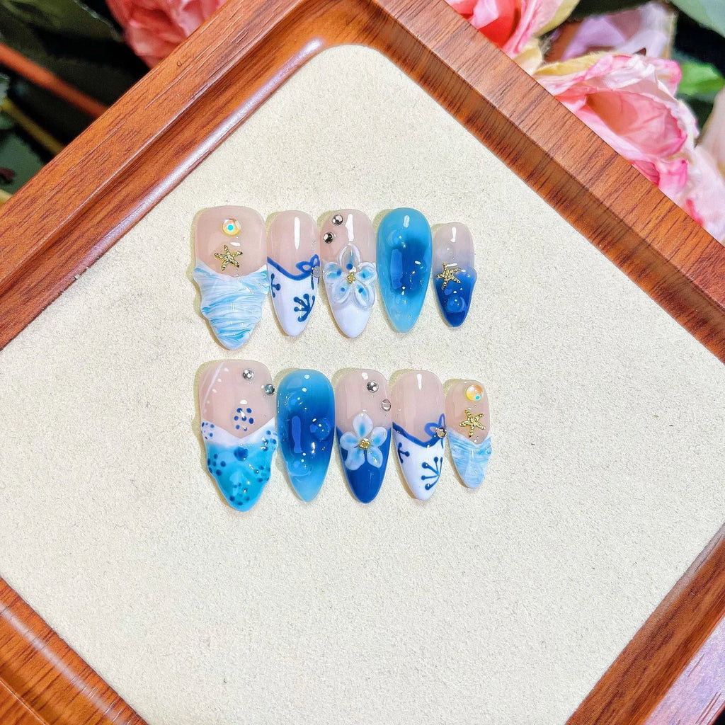 Blue hand-painted carved summer ice transparent plastic fake nails set in sizes XS, S, M, L