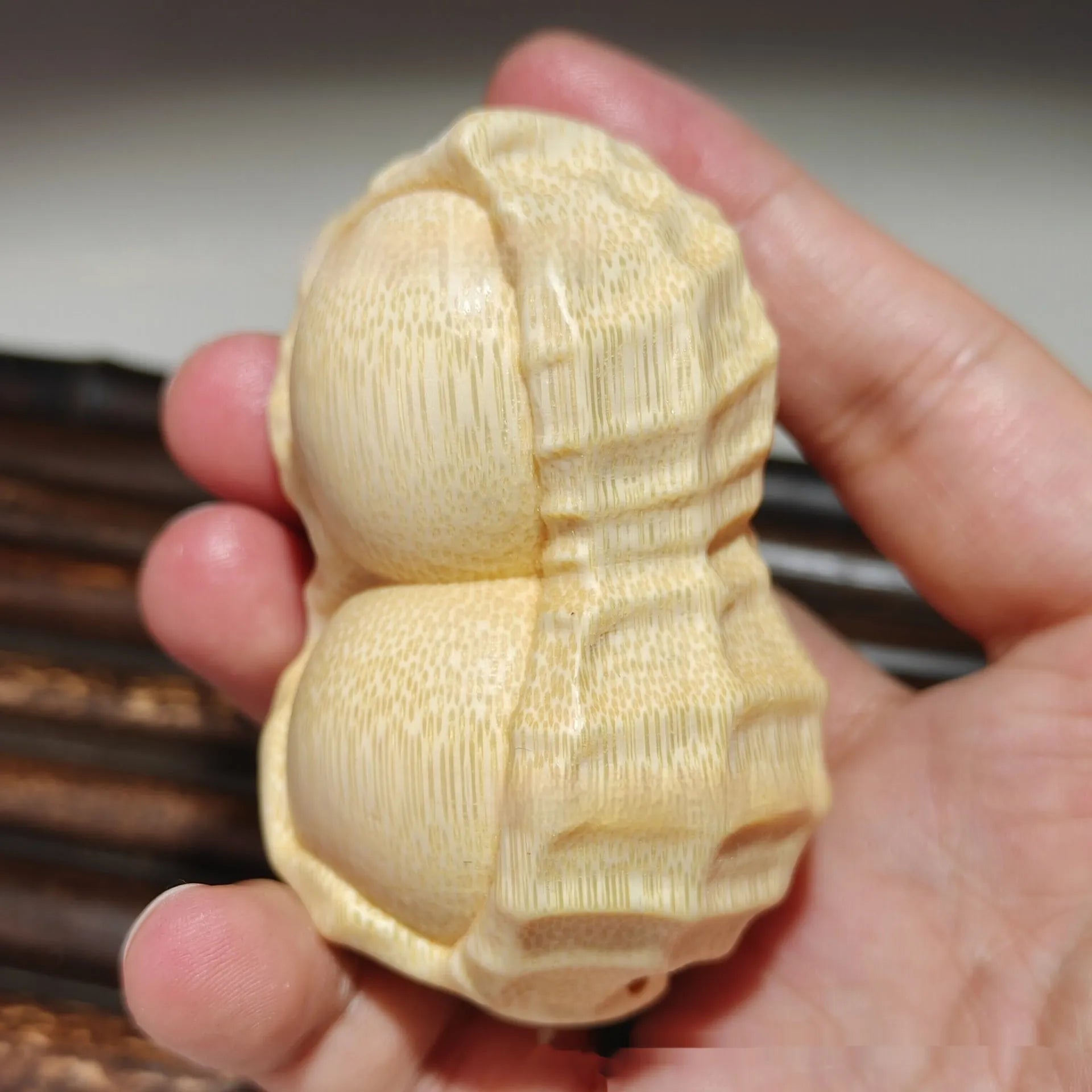Solid natural bamboo peanut ornament with 'good things may happen' engraved message.