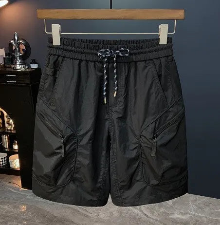 Men's camouflage cargo shorts in loose fit with pockets, shown in khaki colour.