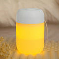 White cylindrical mini USB humidifier with aromatherapy function on wooden desk