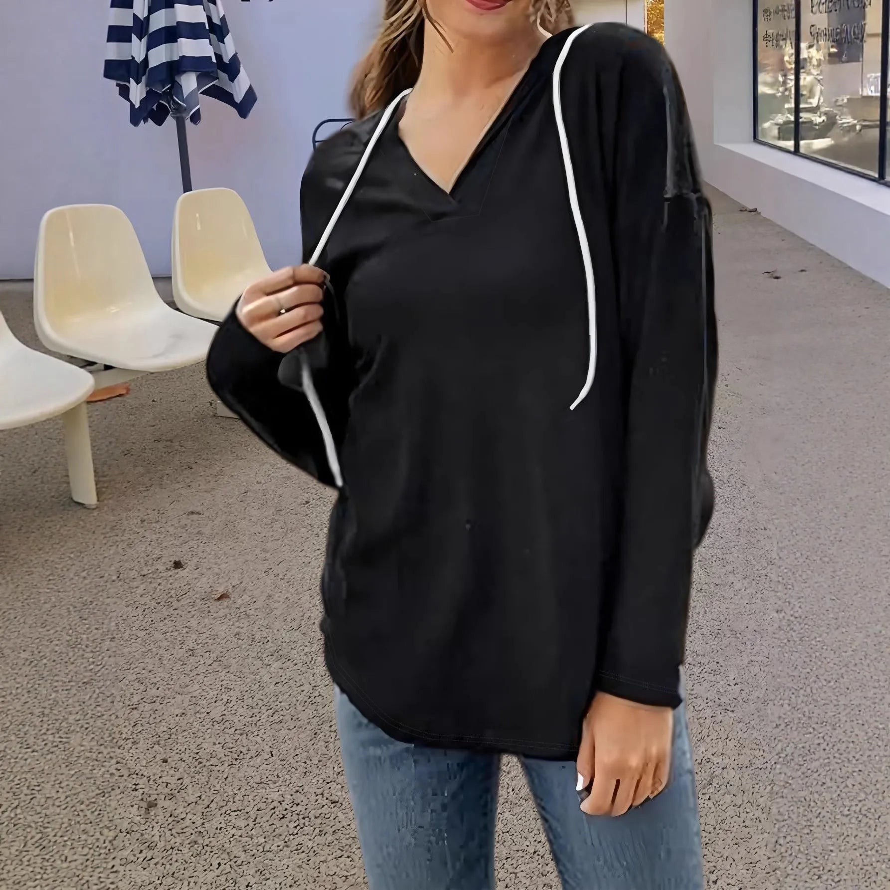 Red women's V-neck hooded sweatshirt with long sleeves on a hanger.