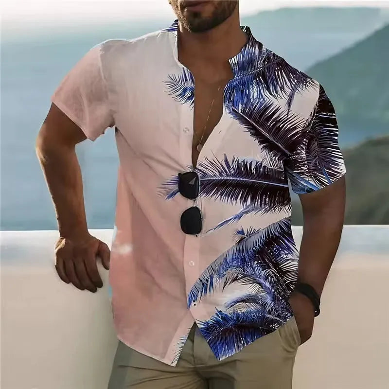 Man wearing a loose-fitting, short-sleeve floral print shirt in a cardigan style against a summer background.