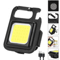 Black aluminium alloy USB rechargeable keychain light with LED, magnet, and folding handle