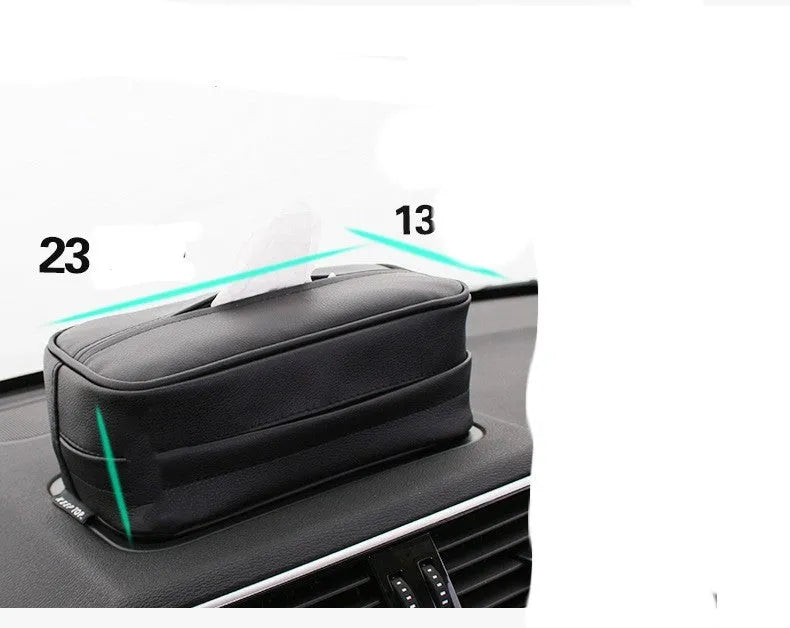 Black leather storage box with removable paper bag inside for car and home organisation.